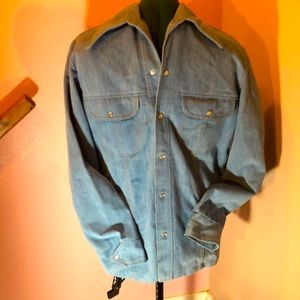 Vintage Denim shirt light blue pearl snap closure on front and sleeves. Soft.